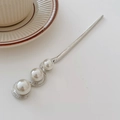 Elegant silver metal hair pin featuring three white pearls in a modern S-shaped design - Silver