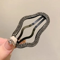 Pinza para el pelo ondulada con pedrería gris y base de metal negro mate - Gris
