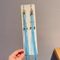 Traditional sky blue silk tassel earrings with golden chains and gemstones for girls - Sky Blue Ribbon and Bell Tassel Style (6)