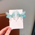 Paire de barrettes papillon en tulle vert menthe brodées avec perles sur carte support - Perles Vertes