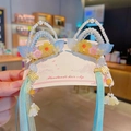 Handmade Chinese style hair clips with blue tassels and floral pearl details - Jin Yi