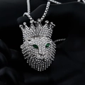 Detailed view of hip hop lion head pendant with sparkling rhinestones and green gem eyes - Rhinestone Crown Lion Head / Silver + 60cm