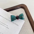 Mini resin bow hair clip in translucent dark green finish with golden handmade lettering - Teal