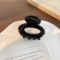 Polished black acetate hair claw clip with oval hollow design and gold handmade logo - Black