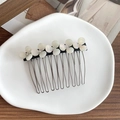 Elegant silver metal hair comb with five white pearlescent flowers and crystal accents - White