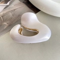 Minimalist white acetate claw clip with gold metal teeth and oval irregular shape - White