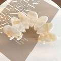 Large cream white marble acetate hair claw clip with elegant wavy fan-shaped design - Iridescent White