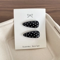 Set of two black polka dot drop-shaped BB hair clips on a white display card - Black Polka Dot