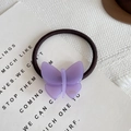 Élastique à cheveux papillon en acétate violet fait main sur un fond blanc texturé - Violet