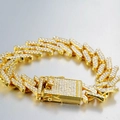 Macro view of 17mm gold Miami Cuban link bracelet with iced-out micro pavé rhinestones - Gold Bracelet