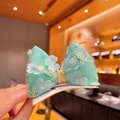 Sparkly mint green sequin bow hair clip with mesh petals for little girls - Green