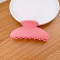 Minimalist matte pink hair claw clip with geometric arched design and round teeth - Pink