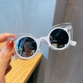 Polarized kids sunglasses featuring white and transparent cat ear frames and round lenses - White