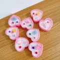 Kids gemstone ring set featuring colorful cartoon shapes in pink heart-shaped boxes - Gemstone Style