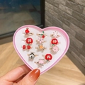 Set de joyería infantil con doce anillos de dibujos animados en caja de regalo de corazón - Estilo Aleación
