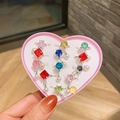 Set de anillos con gemas coloridas para niñas en caja rosa con forma de corazón - Estilo Borla Gema