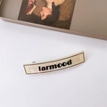 French vintage cream hair clip with black letters and spring clip for elegant styling - Off White