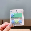 Cute mint green and blue star hair clips for toddler girls on a handmade card display - Green Star