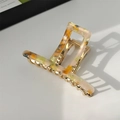 Elegant geometric acetate hair claw with orange and green marble patterns on gold metal base - Colorful Pattern / Yellow Green Iridescent