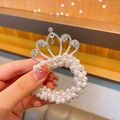 Elegant pearl hair tie for girls featuring a silver crown with sparkling rhinestones - Round Center Crown Style