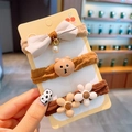 Set di tre elastici per capelli con orsetto marrone e fiocchi beige su cartoncino - 3# Fiore Orso