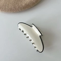 Minimalist cream and black acetate hair claw clip with elegant French style trim - Creamy White with Black Border