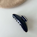Navy blue acetate claw clip with cream trim edge shown next to a beige beret - Navy Blue With White Edge