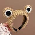 Cute knitted frog headband in khaki brown color with large decorative eye features - Khaki