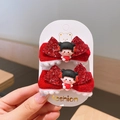 Dettaglio mollette a fiocco rosso con paillettes per bambini con pelliccia e figurine - Small Doll