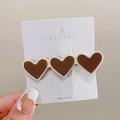 Fermaglio per capelli con tre cuori marroni e bordi crema su scheda di presentazione - Marrone Cuore