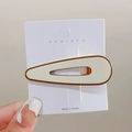 Minimalist milk tea cream teardrop hair clip with brown edges on display card - Off White Teardrop