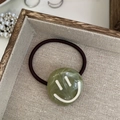 Minimalist elastic hair tie with a green marble-textured smiley face charm accessory - Green