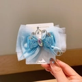 Lazo de tul azul claro para el pelo con corona plateada y lentejuelas brillantes - Azul