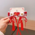 Fermagli a fiocco rosso cinese con bordo in peluche, cuore d'oro e nappe di perle - Cuore