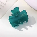 Translucent dark green bow hair clip in acetate resin with gold lettering accent - Teal