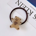 Detailed view of a brown elastic hair tie with a cute resin bear and heart design - Beige Coffee