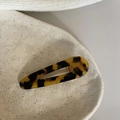 Tortoiseshell acetate hair clip in hollow oval water-drop shape on a ceramic tray - Dark Leopard Duckbill Clip (6.5cm)