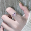 Detail of a pink heart-shaped gemstone ring with silver double-twist band on finger - Adjustable Open / Pink Rhinestone Heart (Silver)
