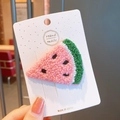 Handmade knitted pink watermelon hair clip with green edge on a white display card - Watermelon