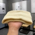 Knitted sports headband in beige color featuring soft thick texture for women - Off White