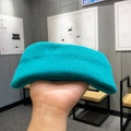 Women's knitted sports headband in turquoise blue color with a soft ribbed texture - Teal