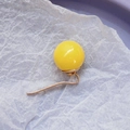 Minimalist ponytail hair pin featuring a polished vibrant yellow resin bead and gold metal hook - Yellow