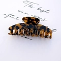 Elegant tortoiseshell acetate hair claw clip with glossy finish and strong metal spring - Amber