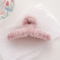 Pink plush faux fur large hair claw clip for elegant women styling on textured background - Light Purple