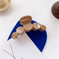 Glossy caramel brown circular hair claw clip for elegant buns and ponytail styling - Brown