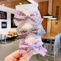 Set di tre fermagli per capelli in tessuto per bambine con motivi floreali viola - Rosa Fragola (3 Articoli)