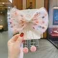Fermaglio per capelli fiocco in tulle rosa con pois colorati e ciondoli a pompon - Fiocco in rete rosa con pompon