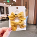 Pair of sweet yellow chiffon bow hair clips for girls displayed on a white product card - Hair Tie (852-6) / Yellow