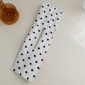 Elegant white floral deft bun maker with black polka dots on a minimalist desk - Polka Dot