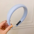 Puffy sponge headband in light blue fabric with a handmade label for women - Blue